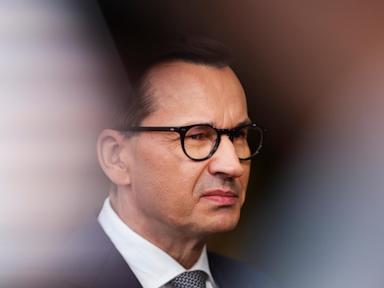 A day of 2 prime ministers in Poland begins the delayed transition to a centrist, pro-EU government