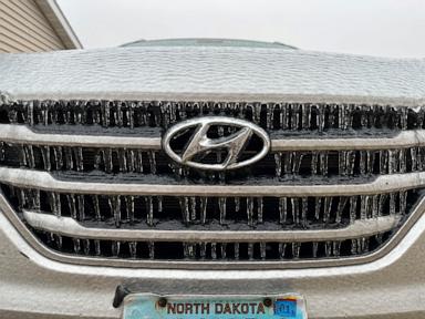 Ice storms and blizzards pummel the central US a day after Christmas